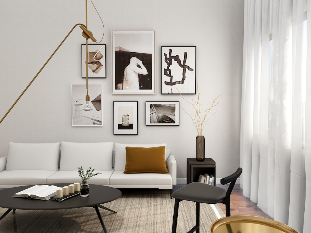 Elegant modern villa interior with a cream sofa, natural materials and framed artwork